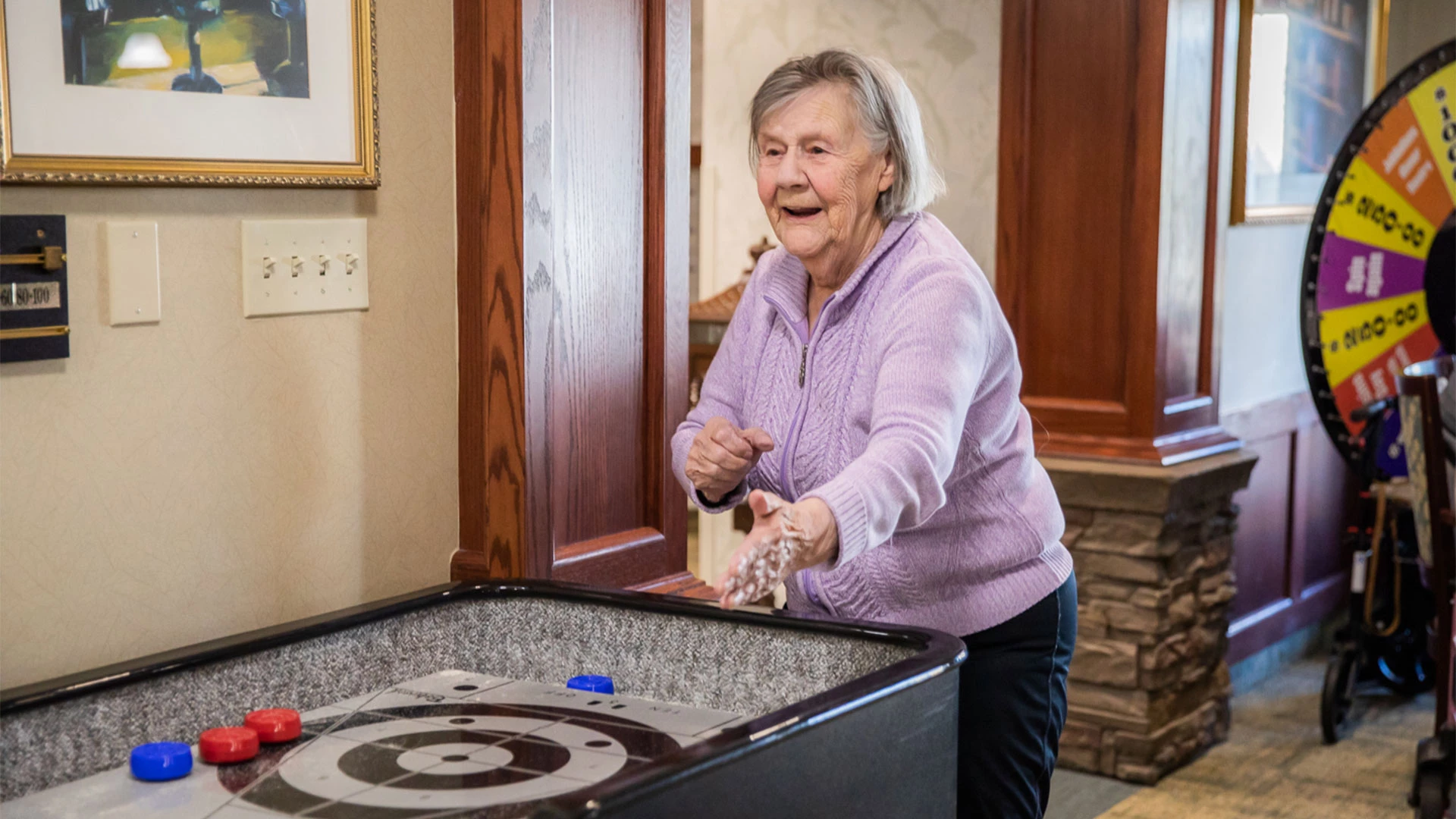 Senior enjoying a shuffleboard